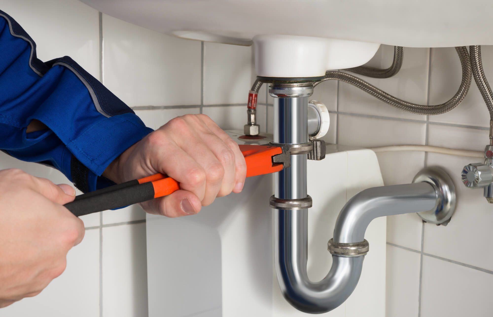 Professional plumber at work